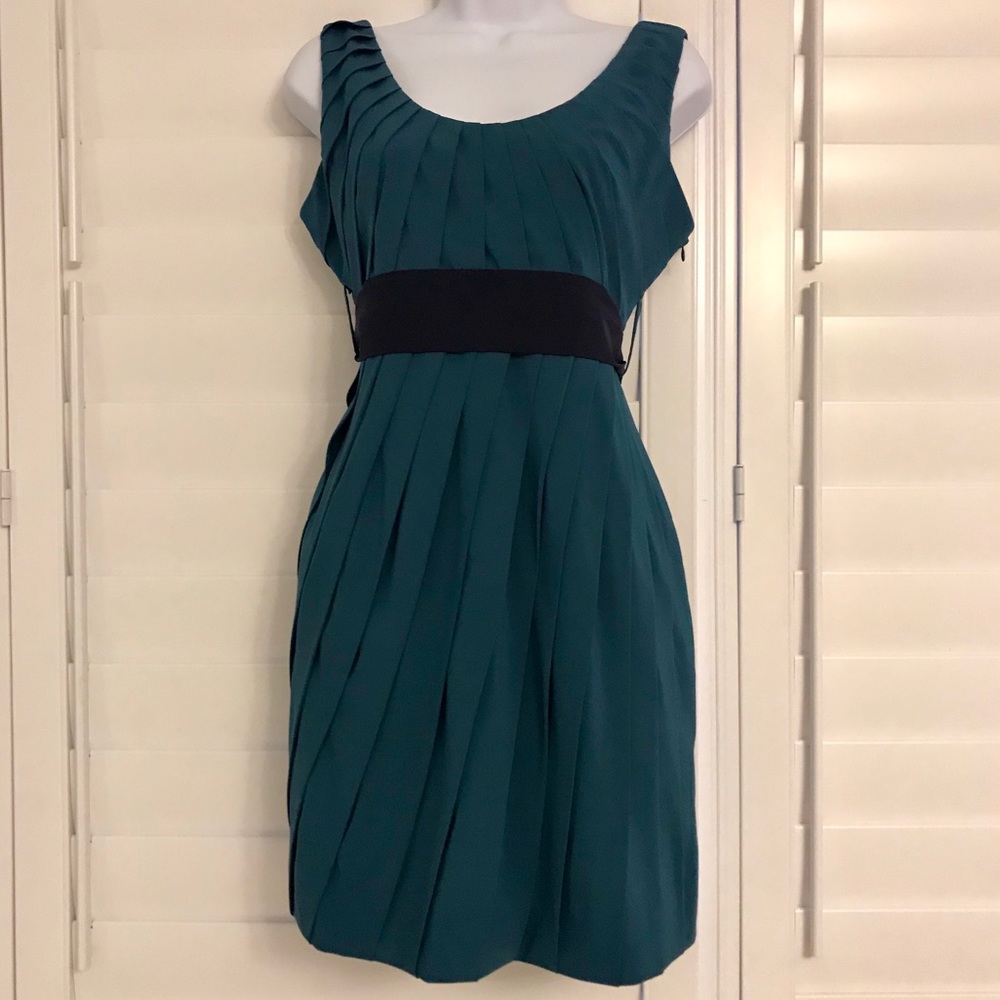 Blue-green sheath dress with eggplant sash